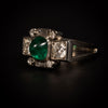 Platinum ring with sugarloaf emerald and diamonds