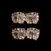 Gold and silver cufflinks with diamond and ruby