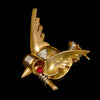 Golden bird brooch